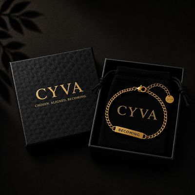 a black box with a gold chain bracelet in it