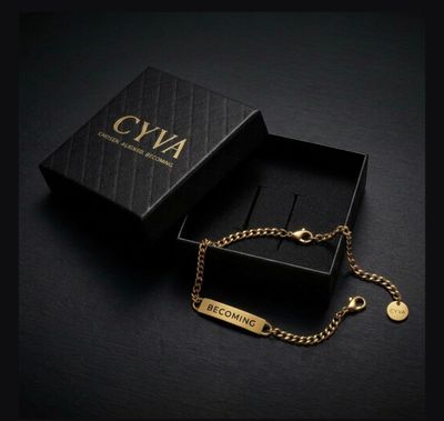 a black box with a gold chain attached to it