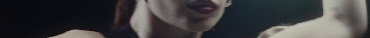 a blurry photo of a woman's face and neck