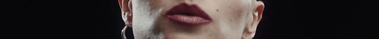 a blurry photo of a woman's mouth and tongue