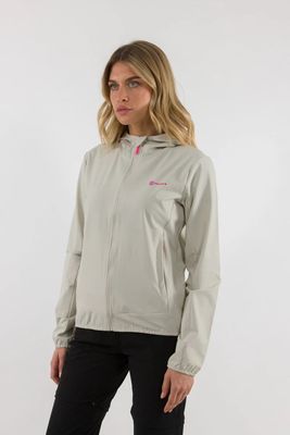 a woman wearing a light gray jacket and black pants