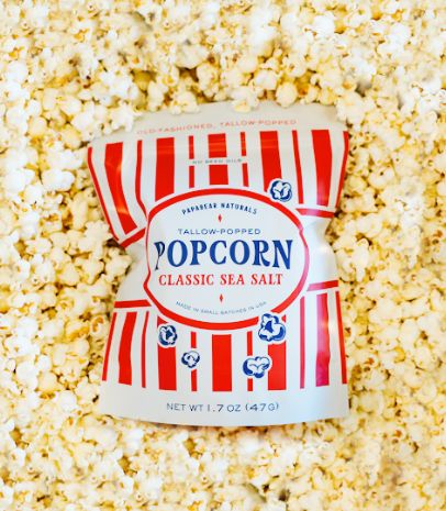 a bag of popcorn sitting on top of a table