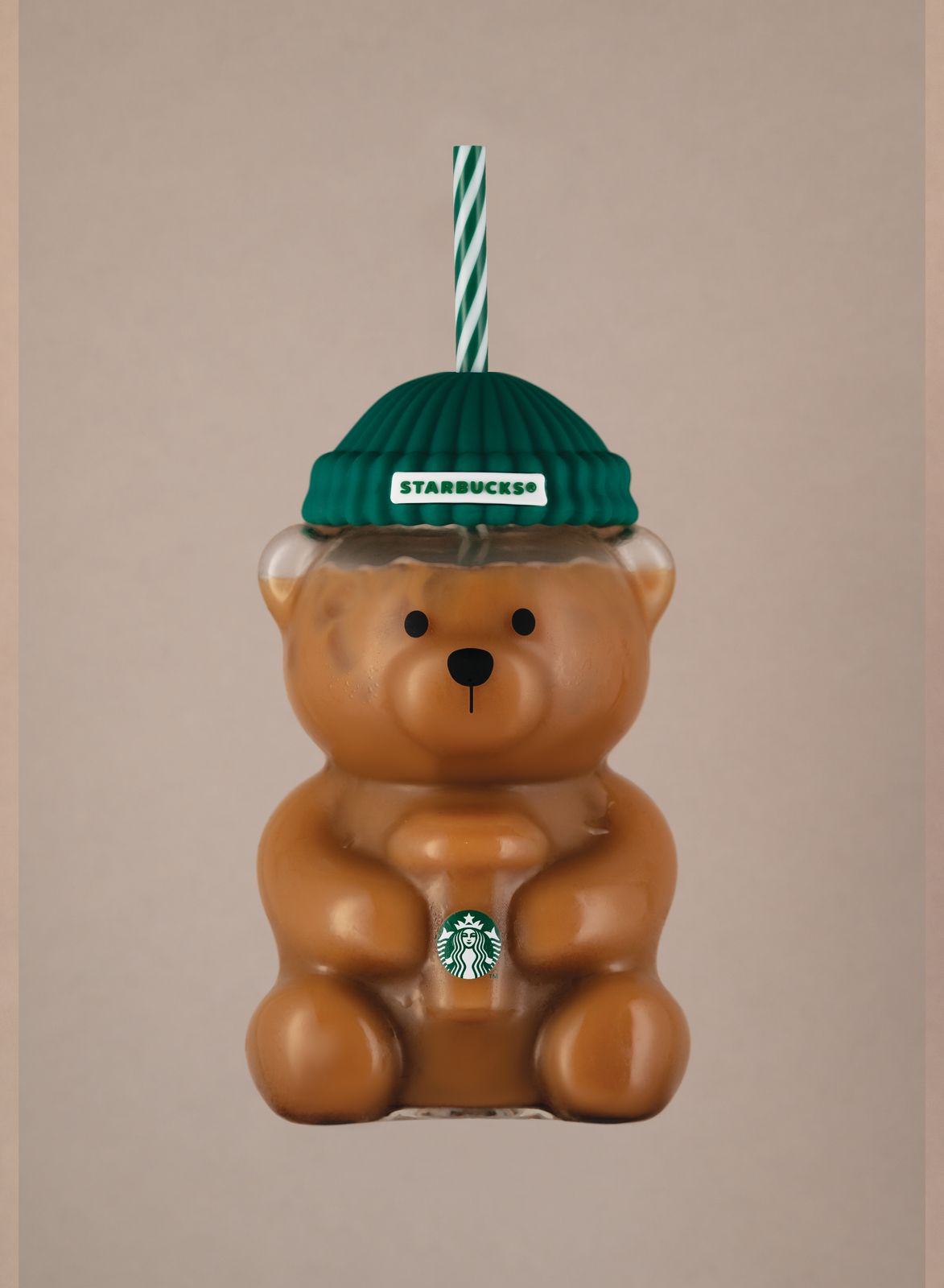 a brown bear ornament with a starbucks hat on