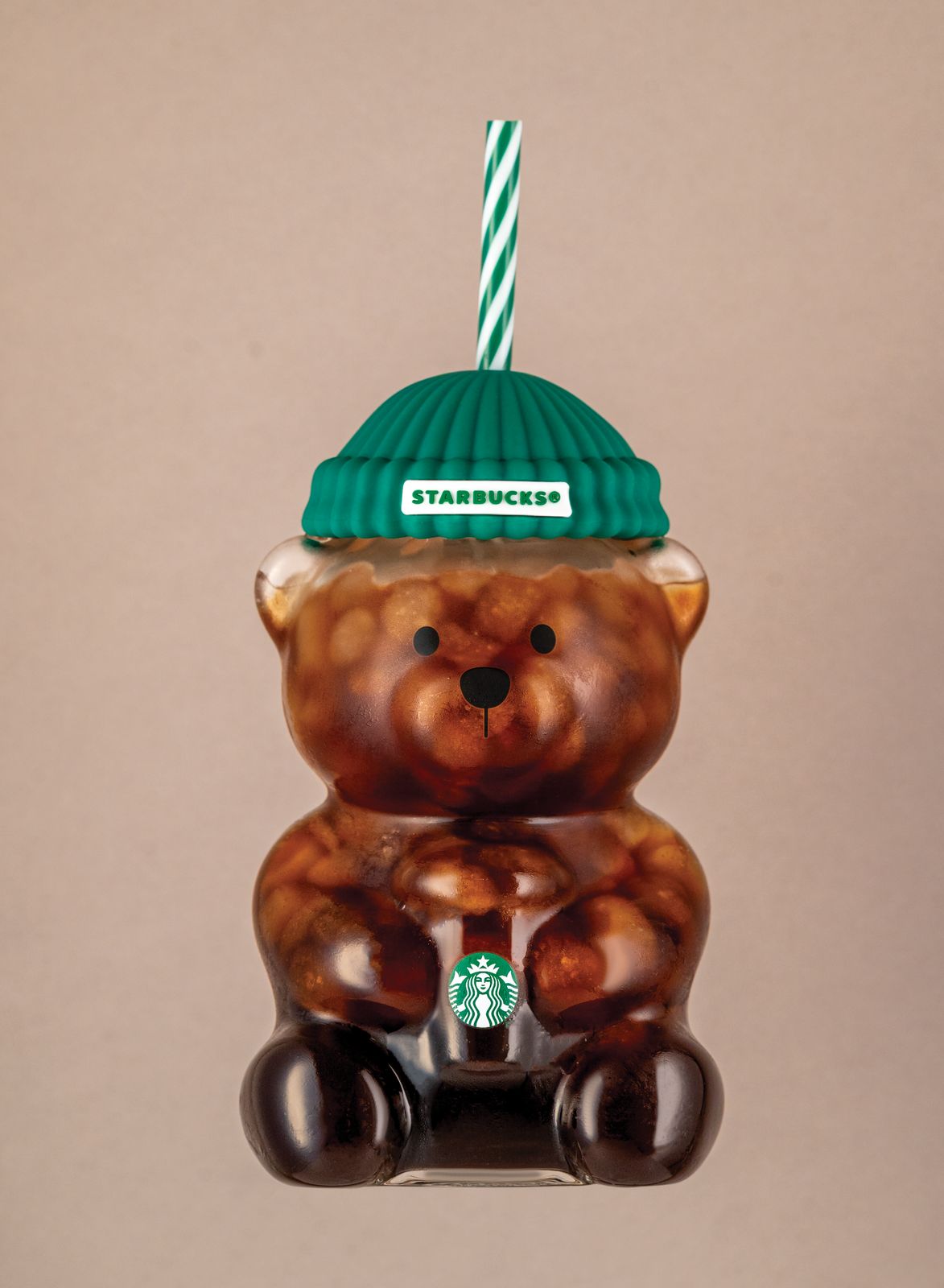 a starbucks bear ornament with a starbucks hat on