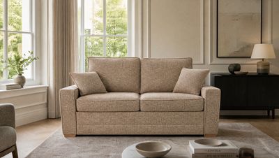 a living room filled with furniture and a window