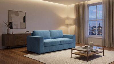 a living room with a blue couch and a coffee table