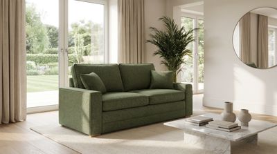 a living room with a couch and a mirror