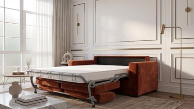 a living room with a couch and a bed