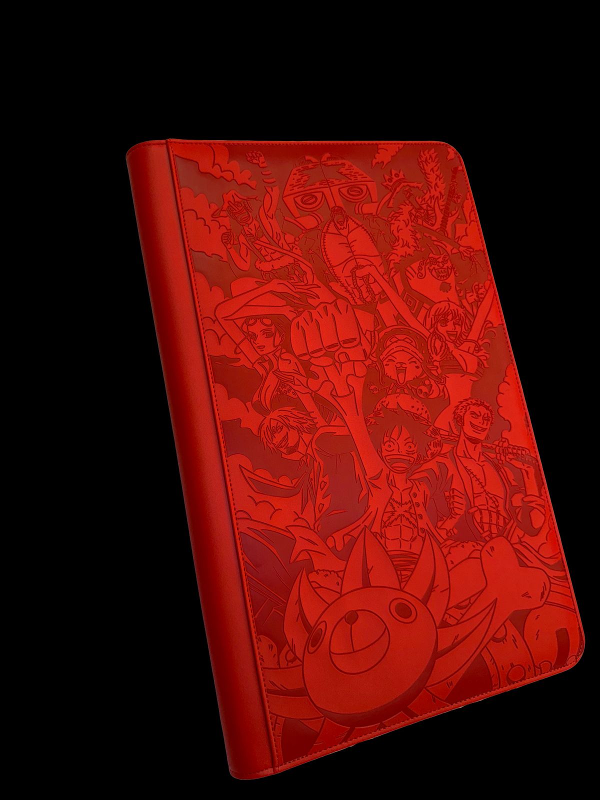 a red notebook with a bunch of cartoon characters on it