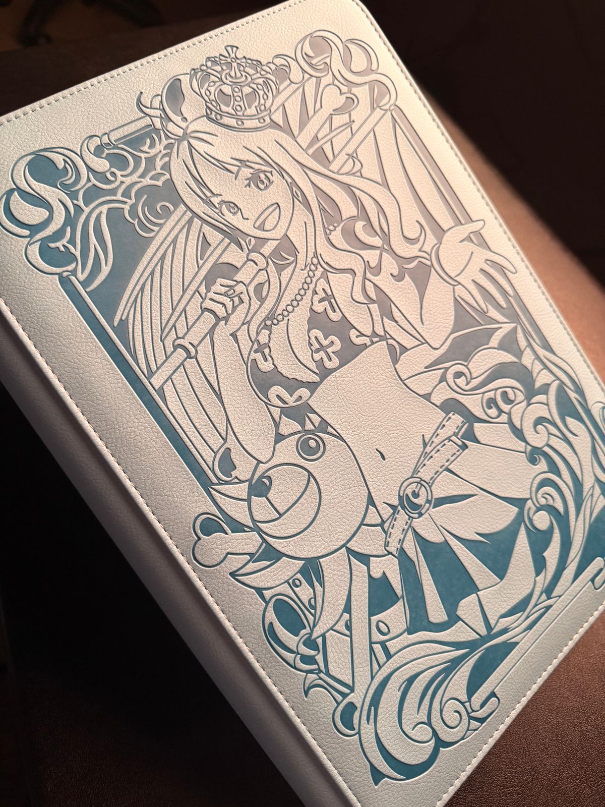 a white and blue book sitting on top of a table