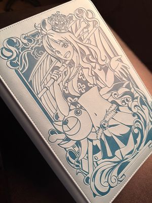 a white and blue book sitting on top of a table