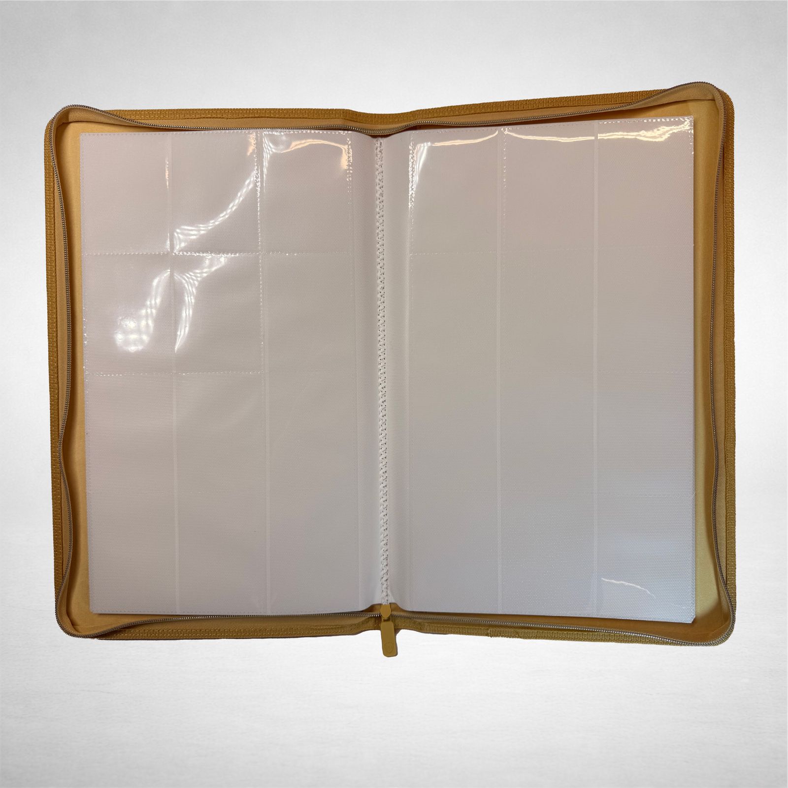 an open book with white pages and gold trim