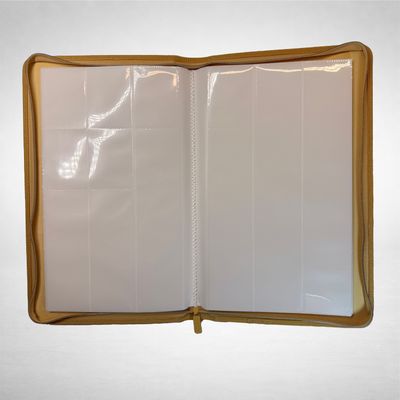 an open book with white pages and gold trim