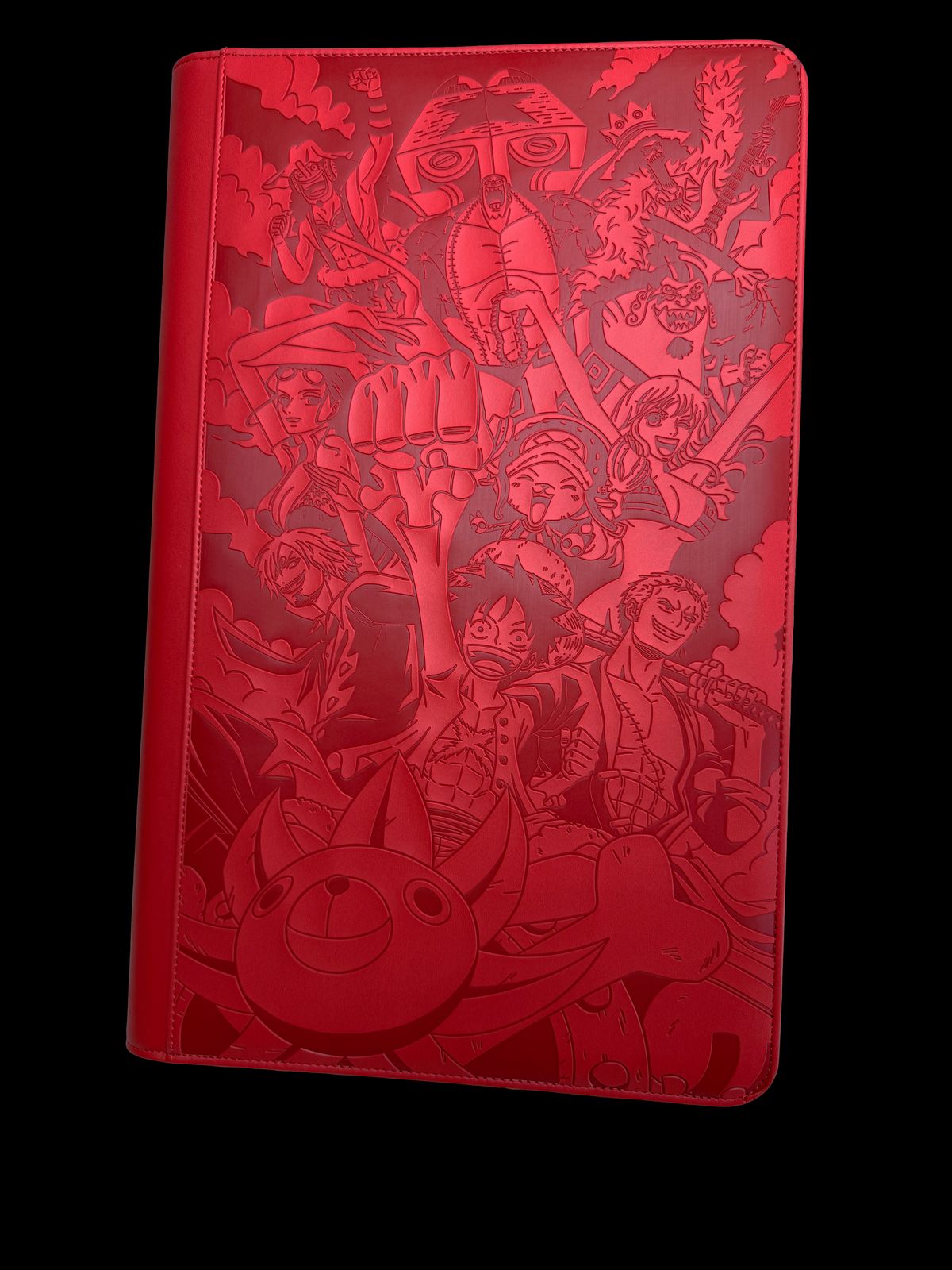 a red notebook with a bunch of cartoon characters on it