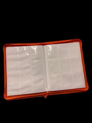 an open orange and white planner book on a black background