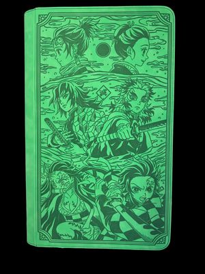 a green notebook with a drawing of a group of people