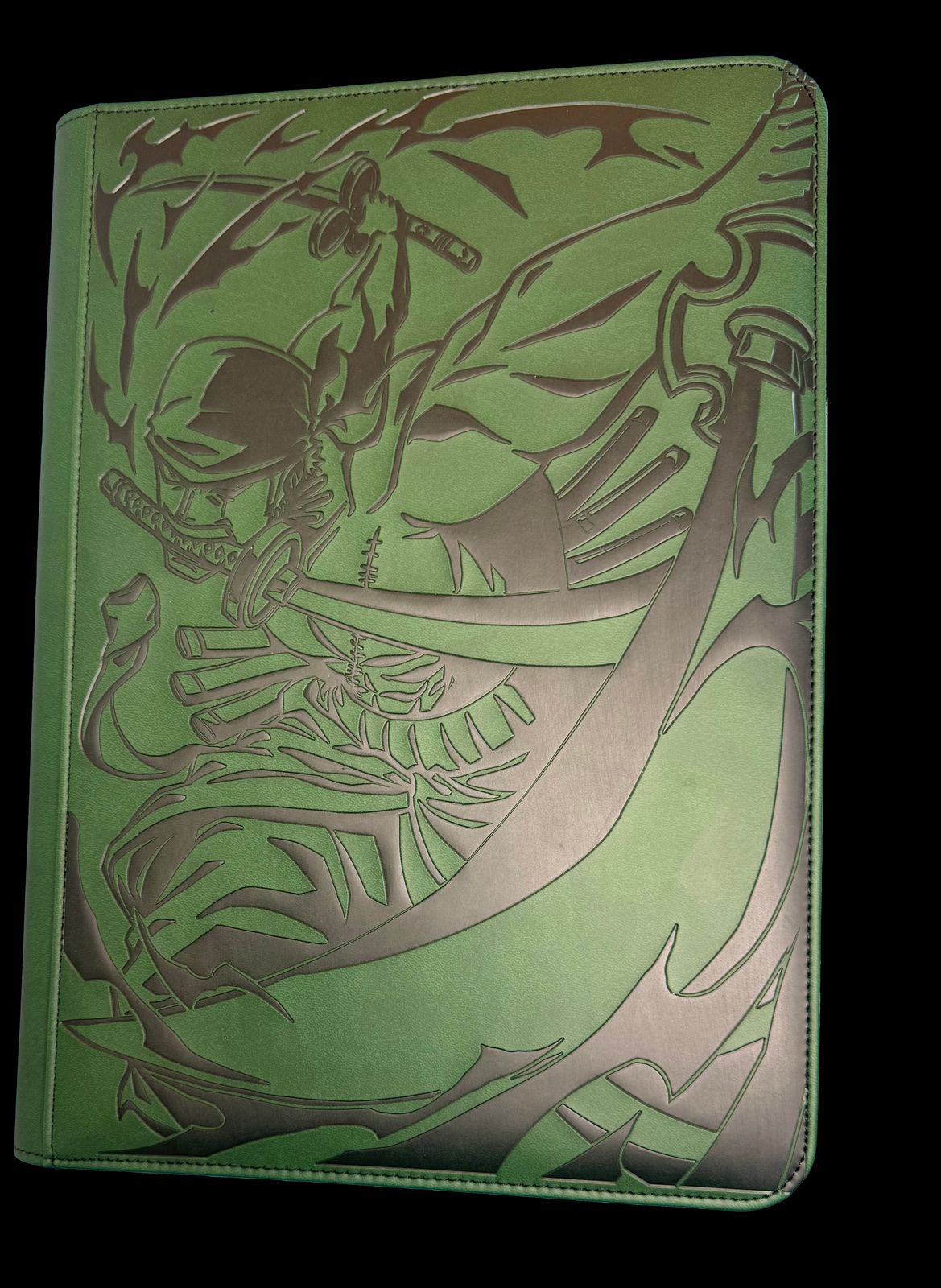 a green book with a picture of a skeleton on it