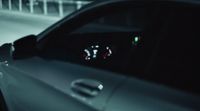 a close up of a car's dashboard with the lights on