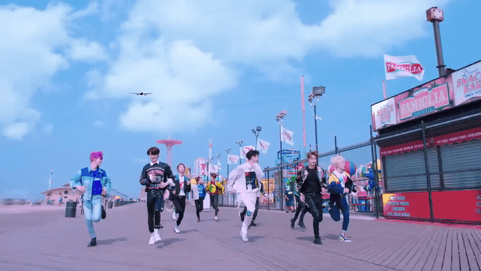 a group of people walking down a street