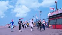 a group of people walking down a street