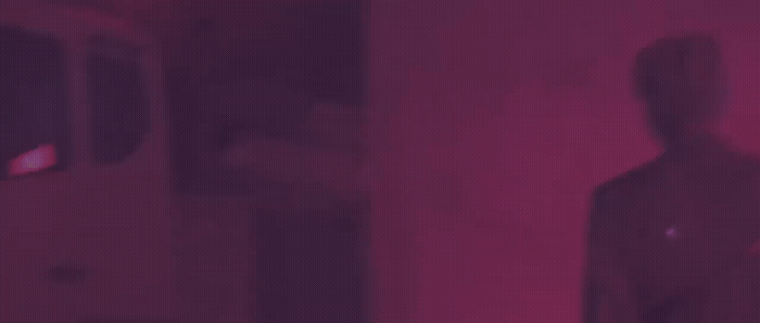 a blurry image of a person standing in a room