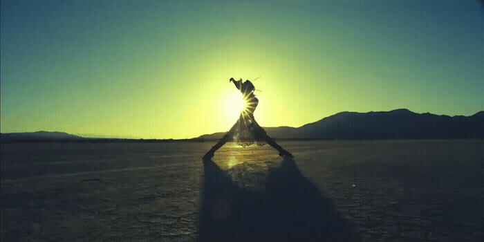 a person standing in the middle of a desert