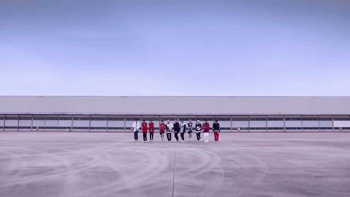 a group of people standing in front of a building