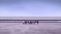 a group of people standing in front of a building