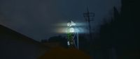 a person standing on top of a roof under a street light