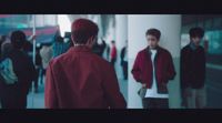 a group of people walking down a hallway