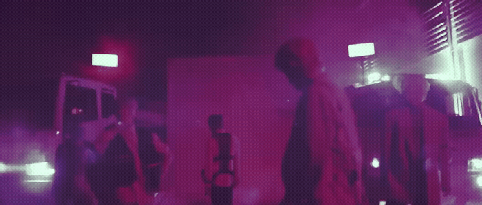 a group of people standing around in a room