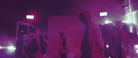 a group of people standing around in a room