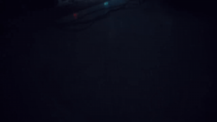 a blurry photo of a person skiing in the dark