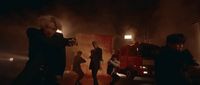 a group of people standing in front of a fire truck