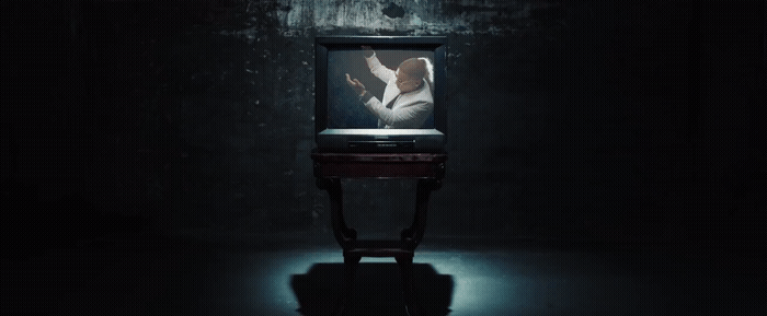 a television sitting in the middle of a dark room