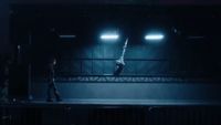 a person standing on a stage in the dark