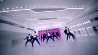 a group of people dancing in a large room