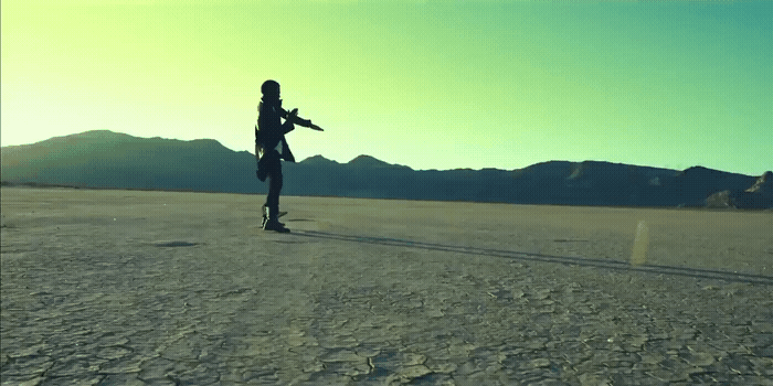 a person standing in the middle of a desert