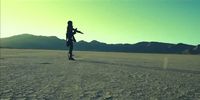 a person standing in the middle of a desert