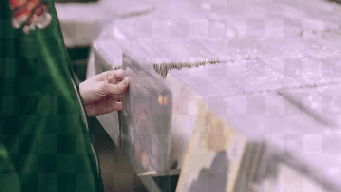 a person holding a piece of paper in their hand