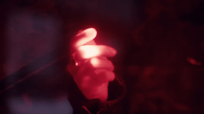 a close up of a red light in the dark