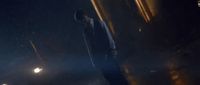 a man walking down a street at night