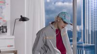 a person in a room with a view of the city