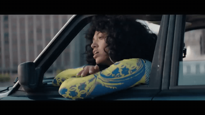 a woman sitting in the passenger seat of a car