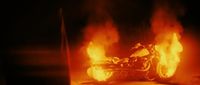 a motorcycle is on fire in the dark