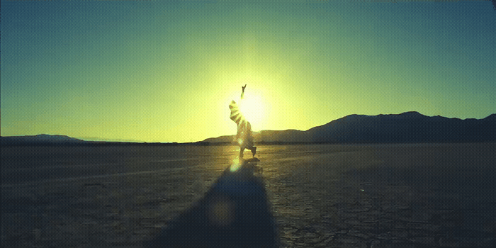 a person standing in the middle of a desert
