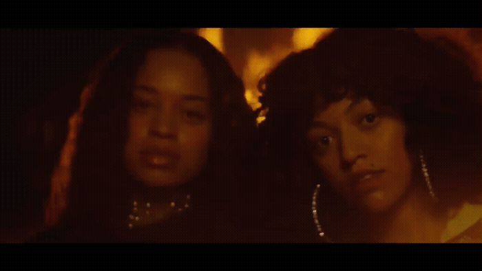 a couple of women standing next to each other