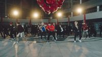 a group of people dancing in a large room