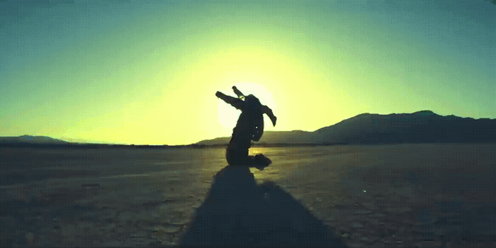 a person standing in the middle of a desert
