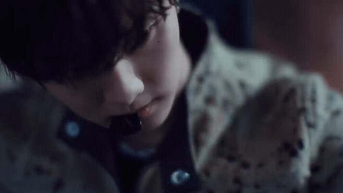 a boy with a cell phone in his hand